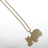 A 9 carat gold pendant, in the form of a hippopotamus, 2g, suspended on an 18 carat gold chain, 4g,