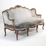 An 18th century French carved walnut and green upholstered canape, by Nogaret of Lyon,