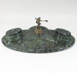 A large early 20th century green marble desk stand, of oval shape,