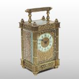 An ornate 19th century continental brass cased carriage clock, having a white enamel dial,