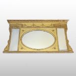 An Edwardian pine and gilt gesso over mantel mirror, relief decorated throughout with swags, shells,