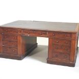 A large 19th century mahogany partners' pedestal desk,