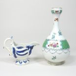 An 18th century Staffordshire blue and white pearlware jug, c1770, of scrolled helmet shape,