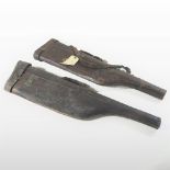 An early 20th century leather gun case, of leg of mutton shape, together with another similar, 80cm,