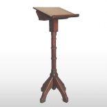 A 19th century Gothic oak lectern, on a ring turned column and splayed base,