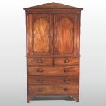 A Regency mahogany linen press, the architectural cornice,