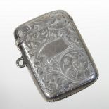 An early 20th century silver vesta case, with engraved decoration, 4.