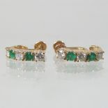 A pair of 14 carat gold emerald and diamond earrings,