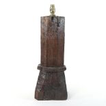 An antique newel post table lamp, of square tapered shape, with modern brass fittings,
