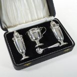 A mid 20th century silver three piece condiment set, comprising a salt, pepper and mustard,
