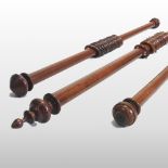A large turned wooden curtain pole, 235cm long overall, together with two smaller, 157cm and 155cm,