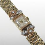 A mid 20th century 14 carat gold and diamond set ladies cocktail watch,