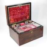 A 19th century rosewood cased dressing case, the red velvet lined interior,