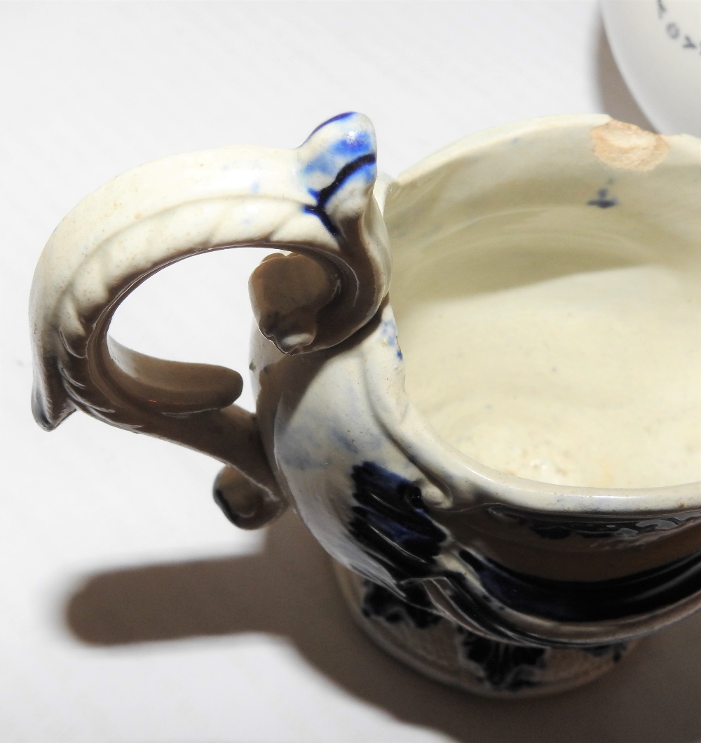 An 18th century Staffordshire blue and white pearlware jug, c1770, of scrolled helmet shape, - Image 2 of 7