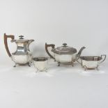 An early 20th century silver four piece tea service, of octagonal form, on paw feet,