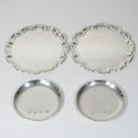 A pair of modern silver dishes, each of circular shape, with a piecrust border, 13cm diameter,