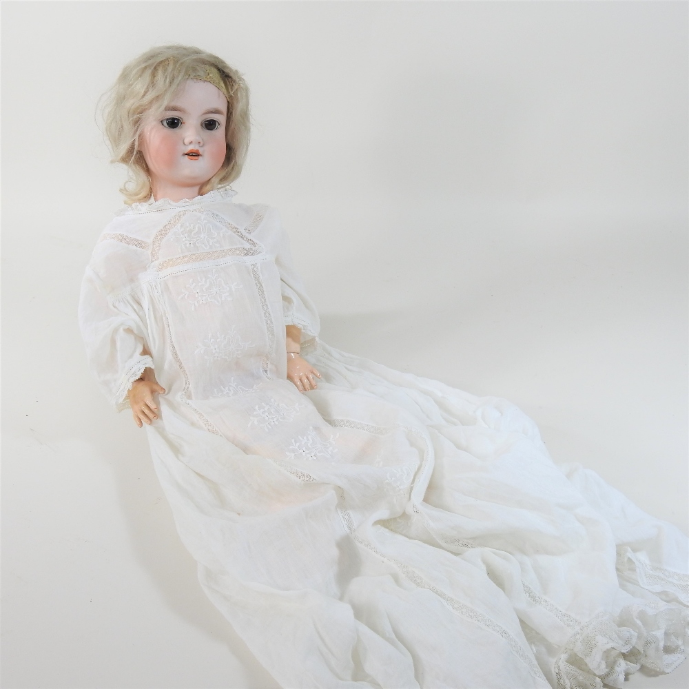 An early 20th century German Armand Marseilles bisque headed doll, stamped no.