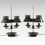 A pair of adjustable tole painted twin table lamps, each having gilt decoration with shades,
