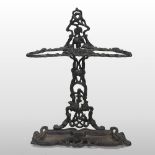 A Victorian black painted cast iron stick stand, stamped Kenrick,