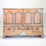 An 18th century Welsh oak and elm coffer on stand, having a hinged lid,