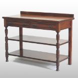 A late Victorian Scottish mahogany three tier buffet, containing a pair of drawers,
