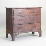 An 18th century oak mule chest, with a hinged lid, over two dummy drawers,