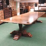 A large extending pedestal dining table, of 17th century style,