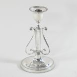 A Victorian silver table candlestick, of lyre shape, on an oval base, London 1896,