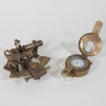 A reproduction metal pocket sextant, together with a compass,