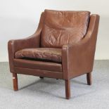A 1970's Danish brown leather upholstered armchair,
