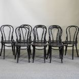 A set of eight black bentwood Thonet style dining chairs