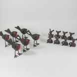 A collection of six tin plate models of robins, 12cm high,