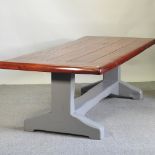 An oak refectory table, with a blue painted base,