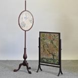 A 19th century mahogany pole screen, together with a tapestry fire screen,