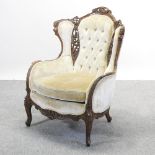 An ornate 19th century style cream upholstered show frame chair