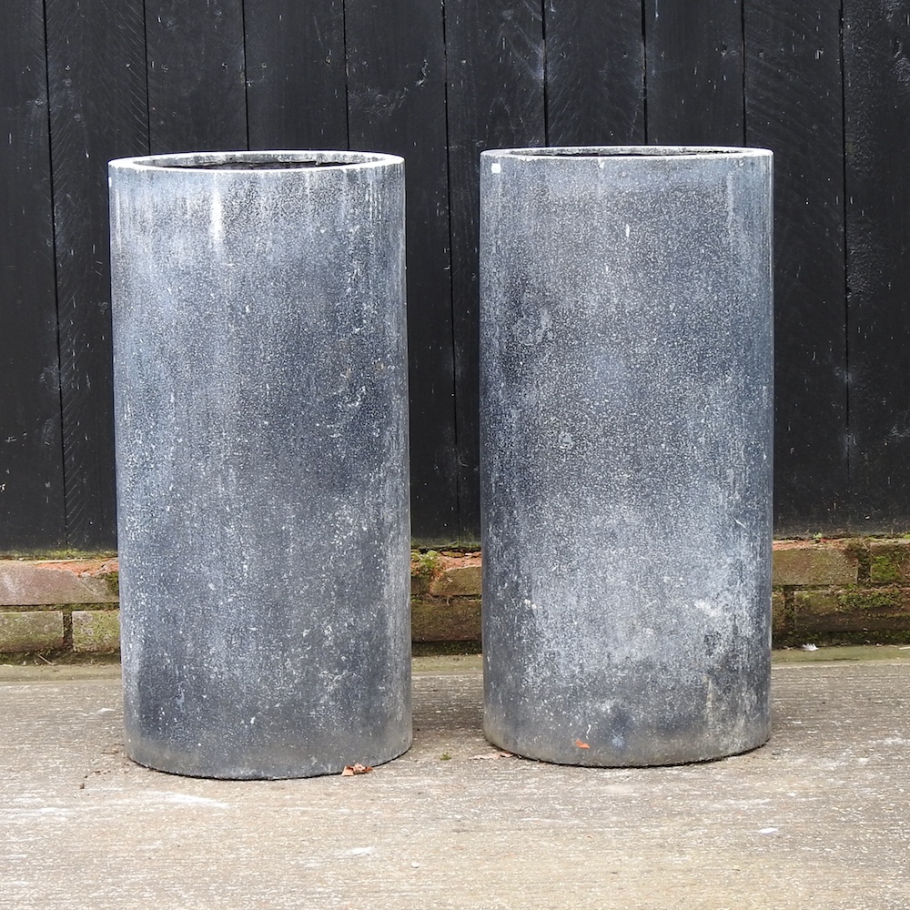 A pair of cylindrical garden planters,