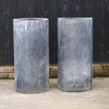 A pair of cylindrical garden planters,