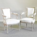 A pair of French style cream upholstered and painted open armchairs