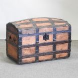 An early 20th century pine and metal bound dome top trunk,