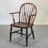 A 19th century elm Windsor armchair,