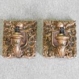 A pair of giltwood armorial wall lights,