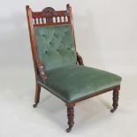 A Victorian carved walnut and green upholstered open chair