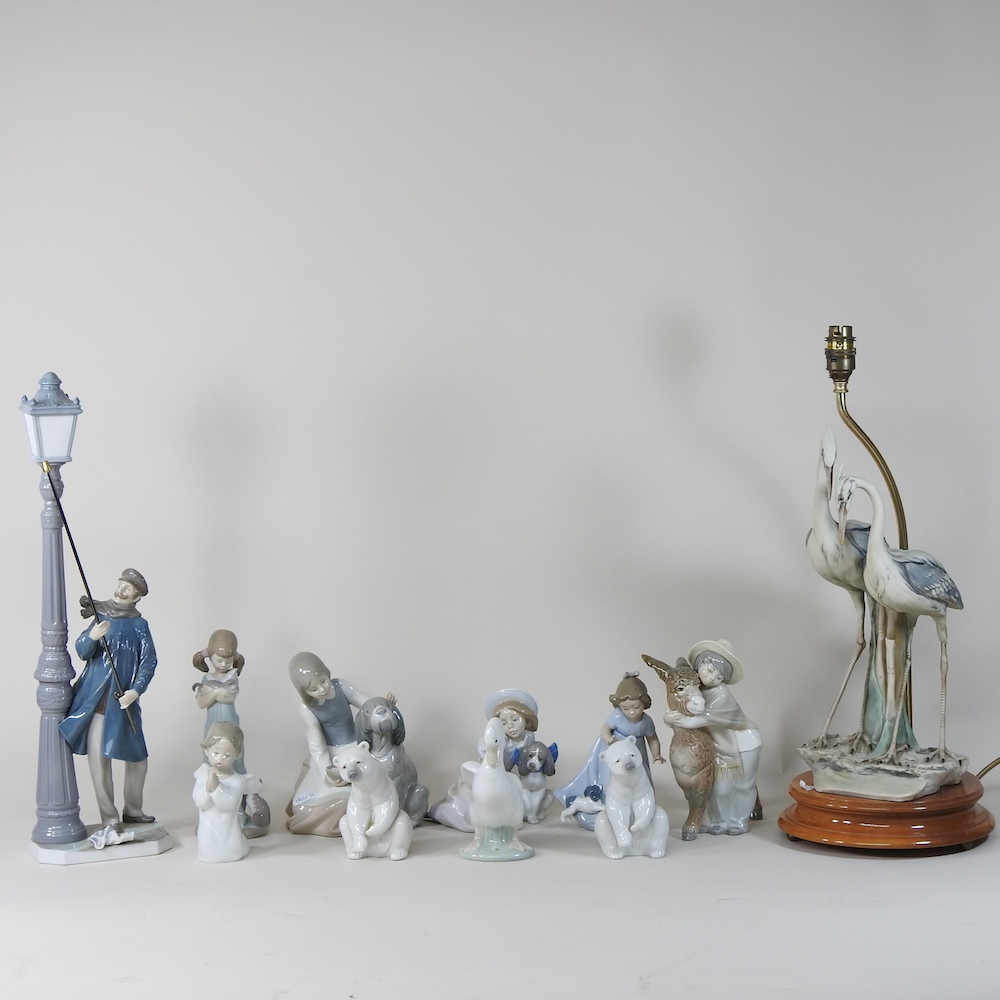 A large Lladro porcelain figure of a lamplighter, 48cm high,