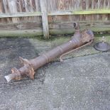 A large antique cast iron garden pump,