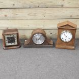 A carved oak mantel clock, with a white enamel dial, 35cm high,