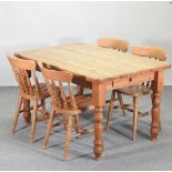 A modern pine rectangular dining table, 137 x 91cm,