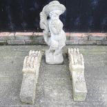 A pair of reconstituted stone architectural corbels, together with a garden statue,