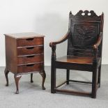 An early 20th century carved oak open armchair, together with an early 20th century filing cabinet,