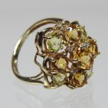 A 9 carat gold coloured citrine and diamond openwork ring, boxed,