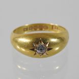 An 18 carat gold and diamond gypsy ring,